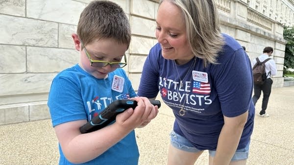 Victoria Schiano and her son, Cole, urged lawmakers to vote against the latest GOP tax bill. They are part of Little Lobbyists, an advocacy group for families of children with complex medical needs. 