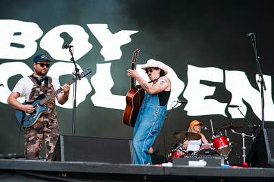A band performing on an outdoor stage