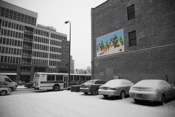 The Current's Replacements snowmen mural on the side of Big Brains Comics in Minneapolis