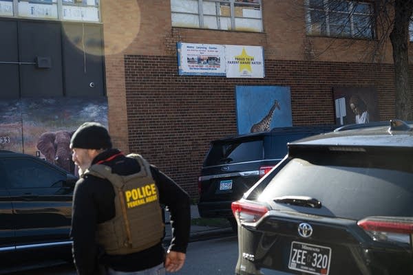 A police agent stands outside a childcare center