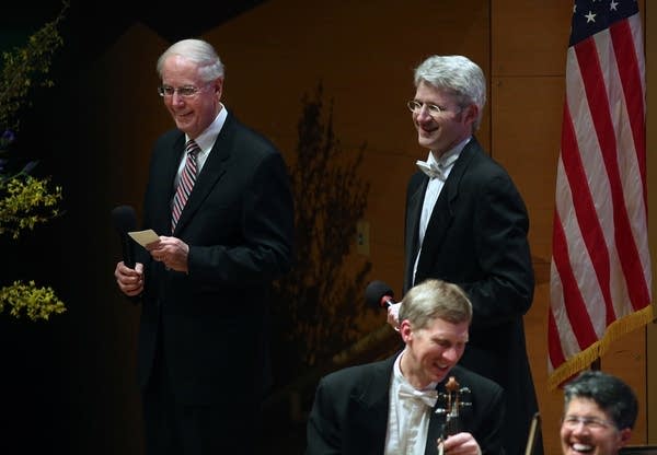 Gordon Sprenger  speaks with patrons at Orchestra