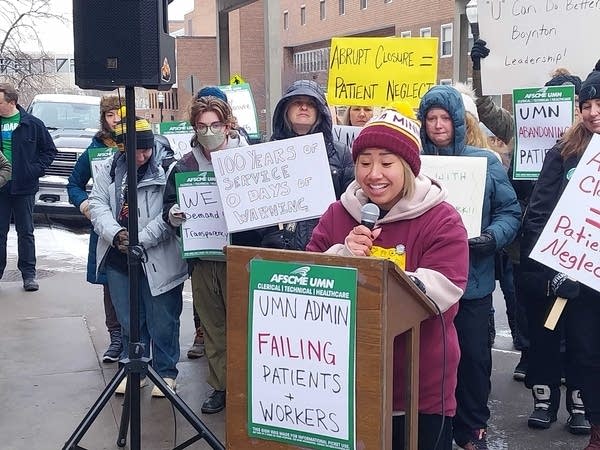 woman speaking in front of clinic