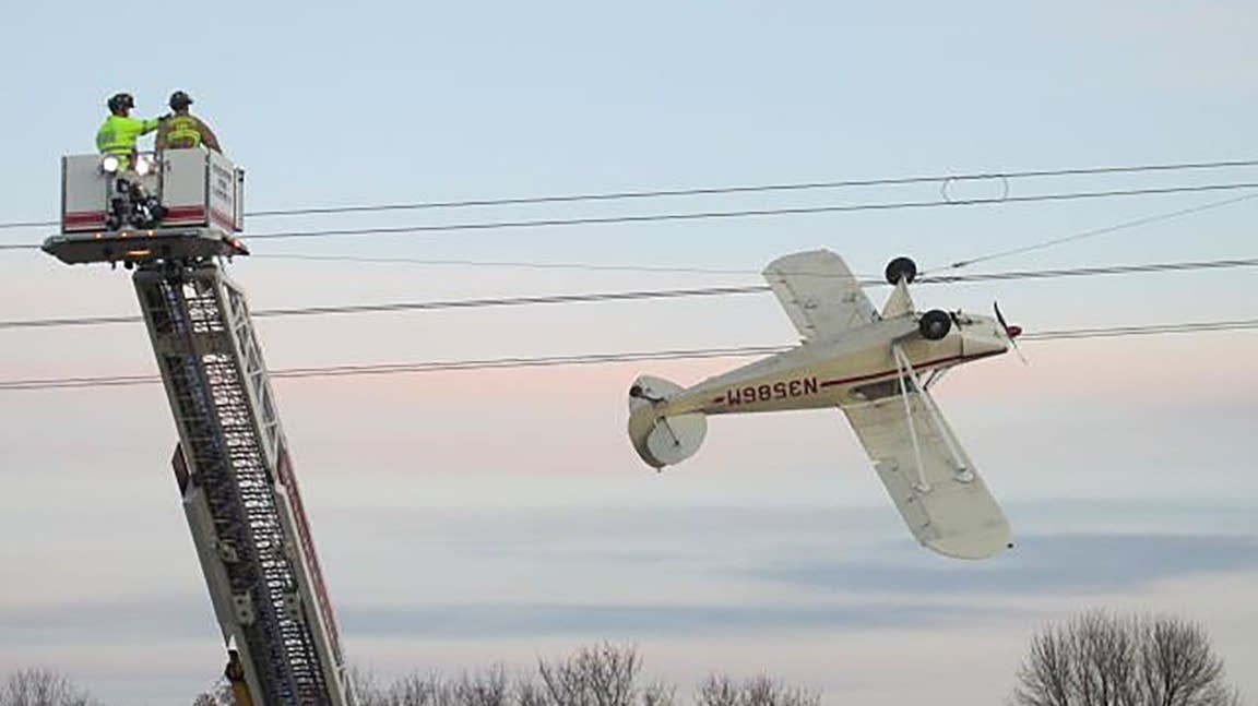 Crews rescue pilot from plane caught in power lines southwest of Twin