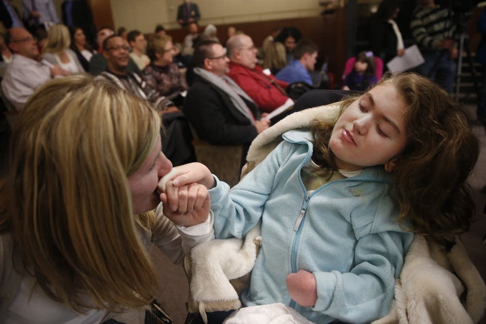 MaryAnn Nelson kisses daughter's hand