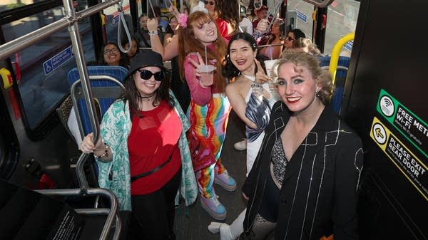 Above, Swifties ride a free shuttle bus to SoFi stadium in Los Angeles to see a Taylor Swift's "Eras" tour show in August 2023.