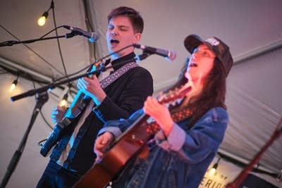 clare doyle and her band performing under a tent 07