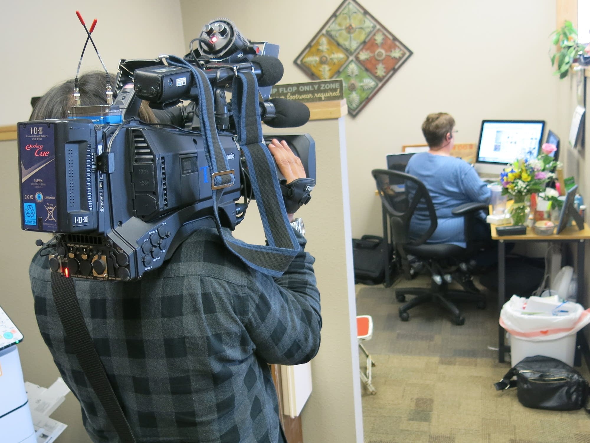 A videographer from the Tokyo Broadcasting System takes video.