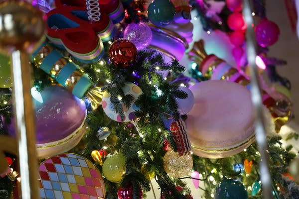 WASHINGTON, DC - DECEMBER 02: A carousel surrounds the White House Christmas Tree during a media preview of the 2024 holiday decorations at the White House  on December 02, 2024 in Washington, DC. The theme for this year's White House holiday decorations is “Season of Peace and Light.”