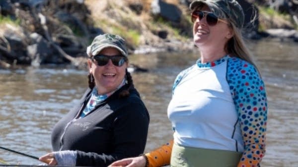 Dylan Demery of She's Fly, left, fishing with her business partner, Emily Anderson.