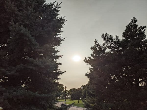 A Thick elevated smoke layer above the Twin Cities dimmed the sunshine Monday.