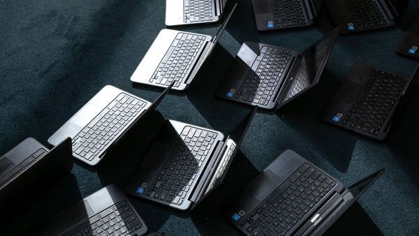 Chromebooks lie out after being cleaned in preparation for the Sept. 8 start of school at Newfield Elementary School on August 31, 2020 in Stamford, Connecticut.