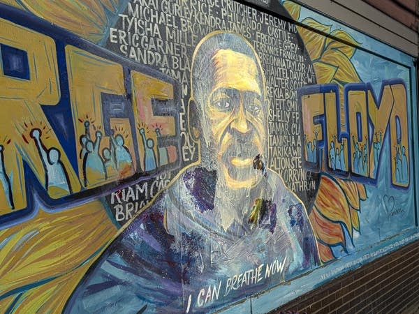 Activists, artists work to restore vandalized George Floyd mural