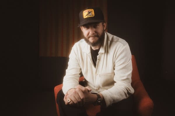 Justin vernon posing for photos