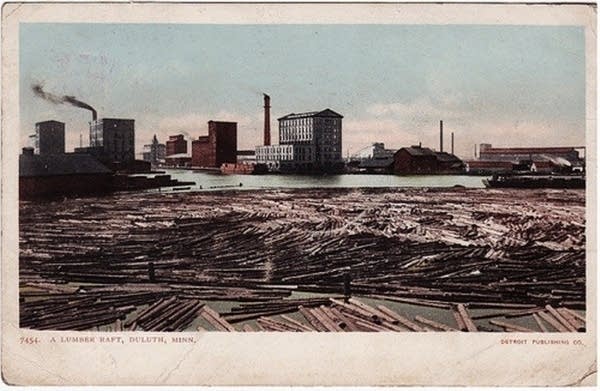 A vintage postcard of logs and mill in Duluth.