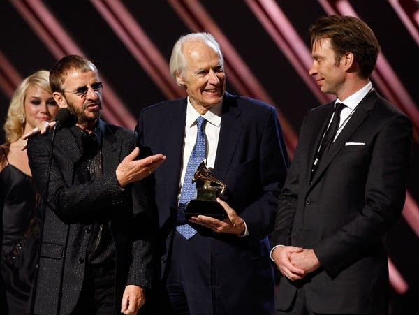 Musician Ringo Starr of the Beatles, Beatles producer Sir George Martin (center) and producer Giles Martin accept the Best Compilation Sountrack Album award for "Love" onstage during the 50th annual Grammy awards held at the Staples Center on February 10, 2008. in Los Angeles.