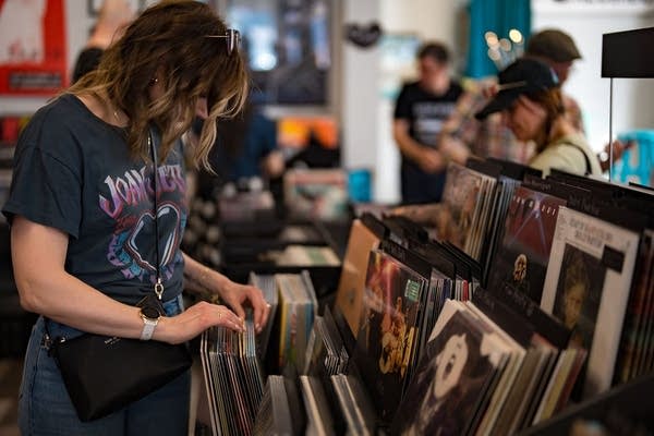 A customer browses at Lucky Cat Records in Minneapolis during Record Store Day 2025.