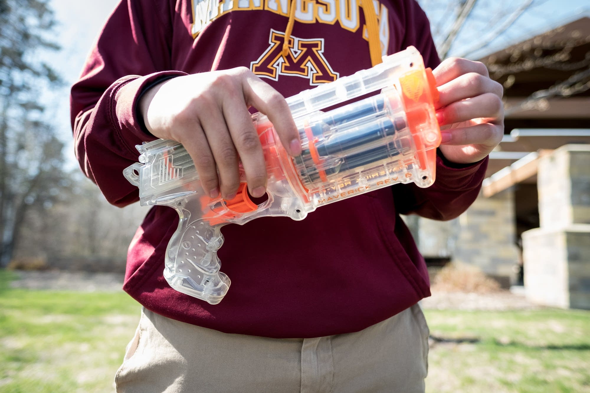 Daniel Wong holds his weapon of choice for Nerf wars.