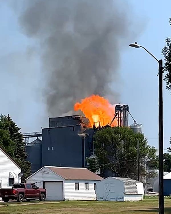 A fire burns at a grain elevator