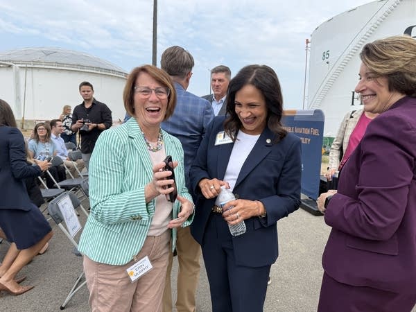 Three women laugh