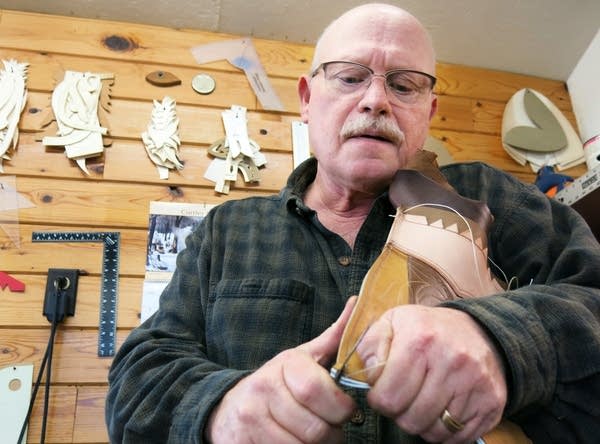 Crafting handmade cowboy boots the old way in northern Minnesota