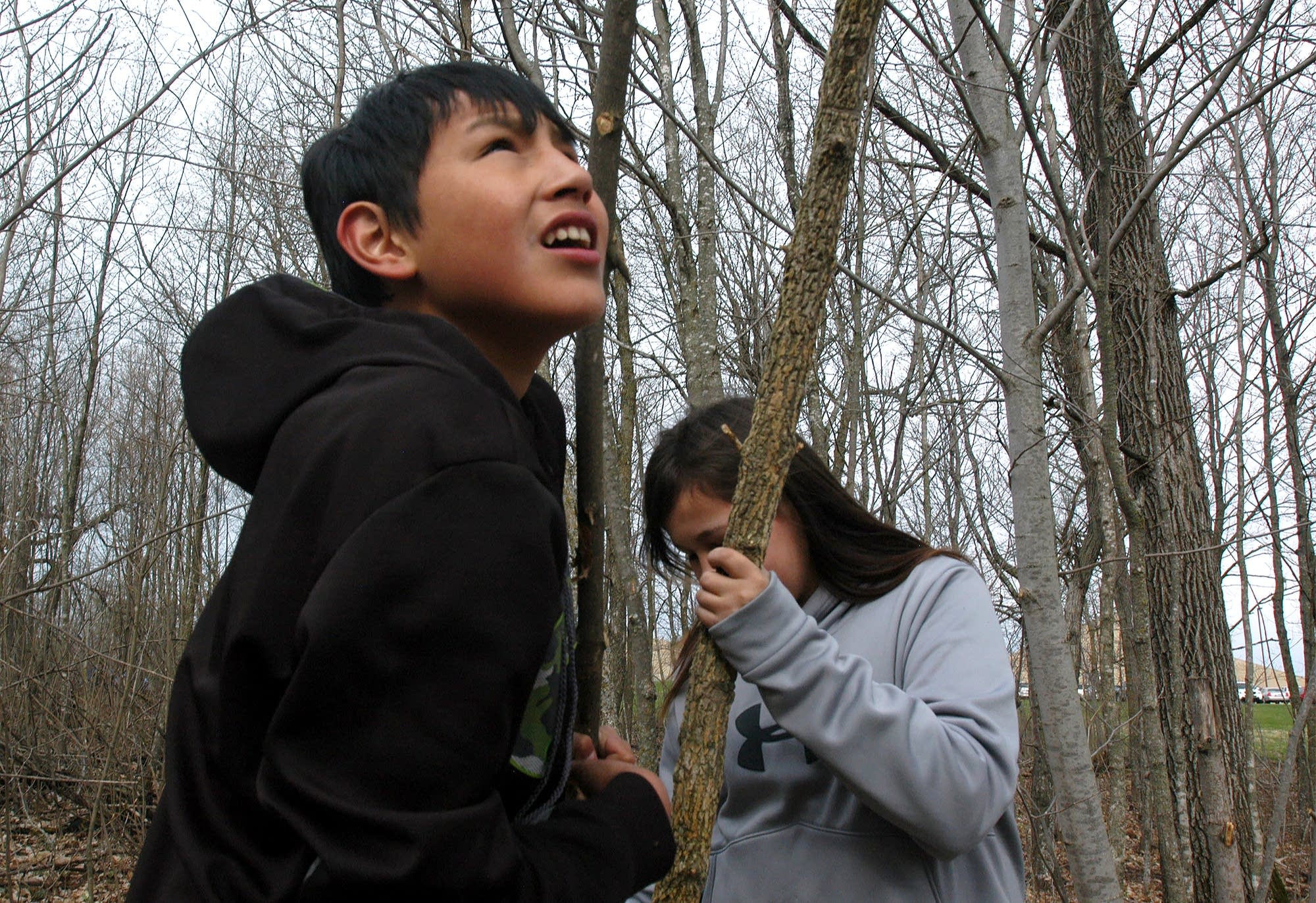 Seventh-grader Tyson Norcross held down a pole for a long house.