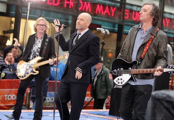 (L-R) Mike Mills, Michael Stipe, and Peter Buck of R.E.M. perform during the NBC 'Today' show concert series at Rockefeller Center on April 1, 2008, in New York City.