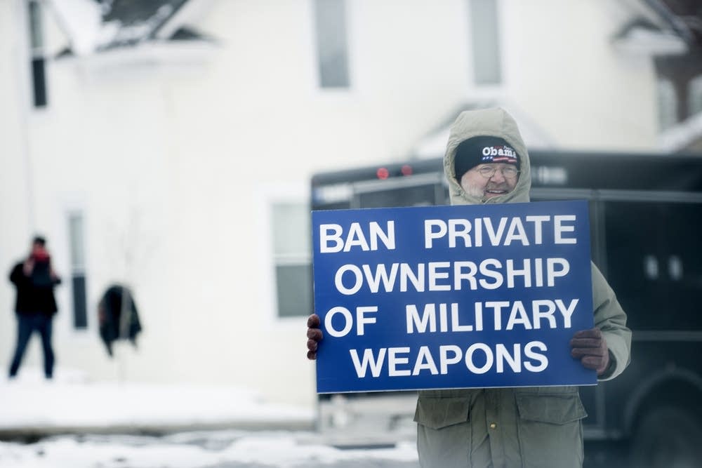 Demonstrator holds sign