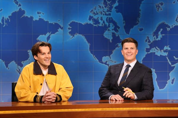 Two actors perform together on a television soundstage
