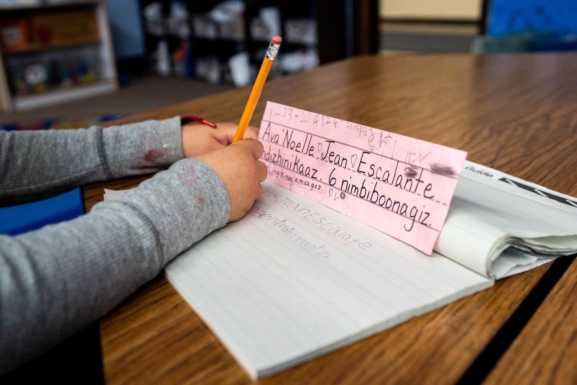 A student at Bdote Learning Center writes in Ojibwe.