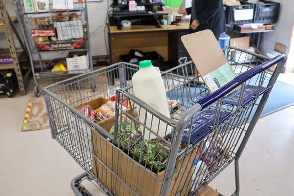 A shopping cart loaded with groceries 