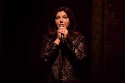 Person singing on stage