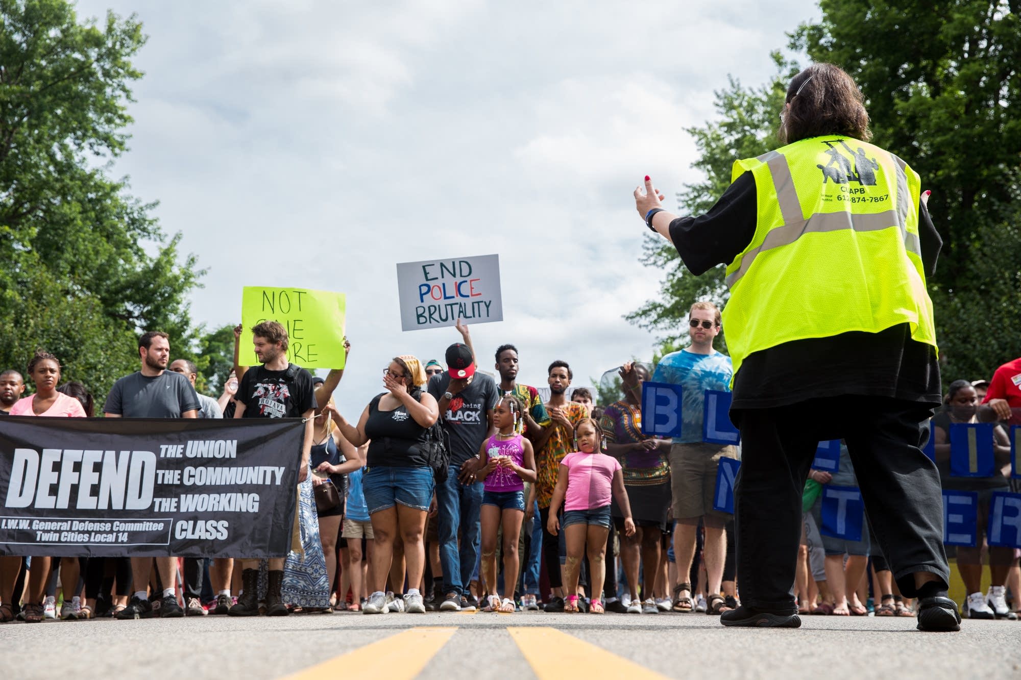 Organizers guide protesters.