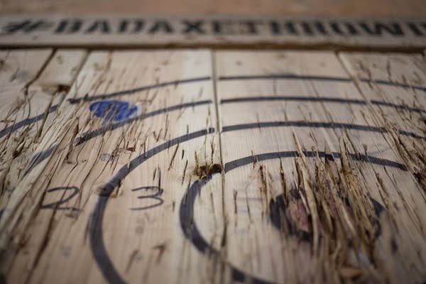 Axe marks litter the bullseye in a throwing booth at Bad Axe Throwing.