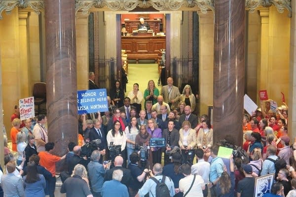 People gather outside the Minnesota House chambers
