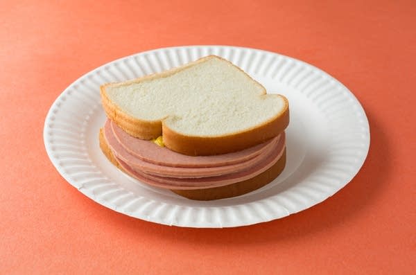 stock photo of bologna sandwich on paper plate