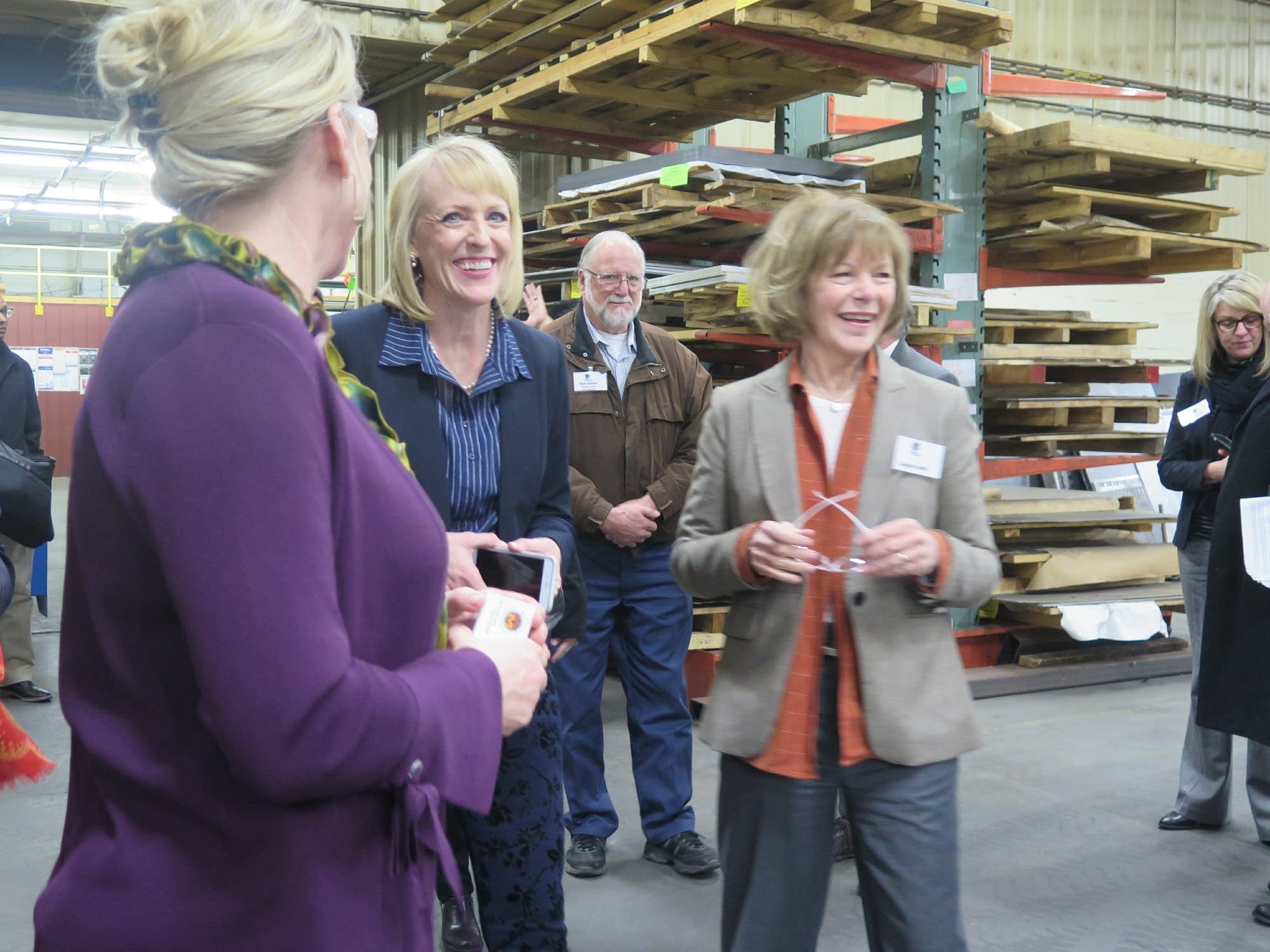 Traci Tapani leads U.S. Sen. Tina Smith on a tour in 2018.