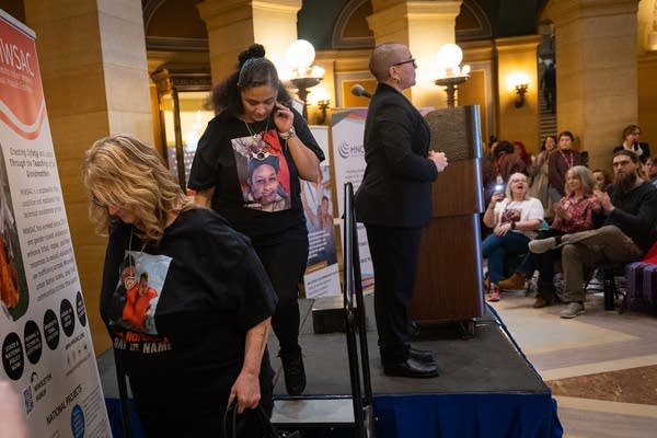 Two women leave a stage