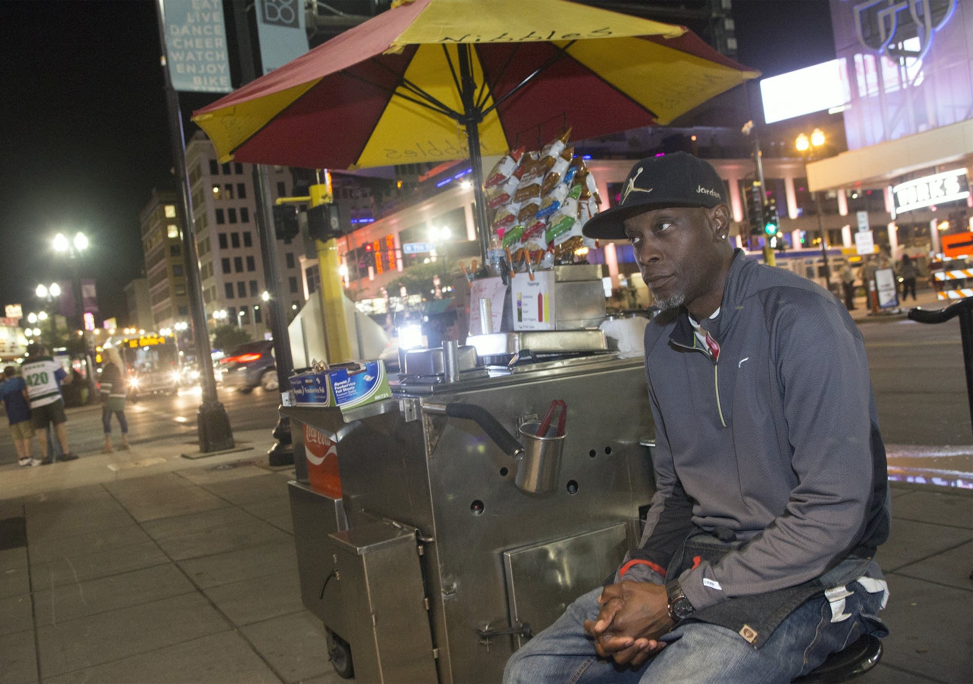 Toby Rogers, Sr., waits for customers along Hennepin Ave.