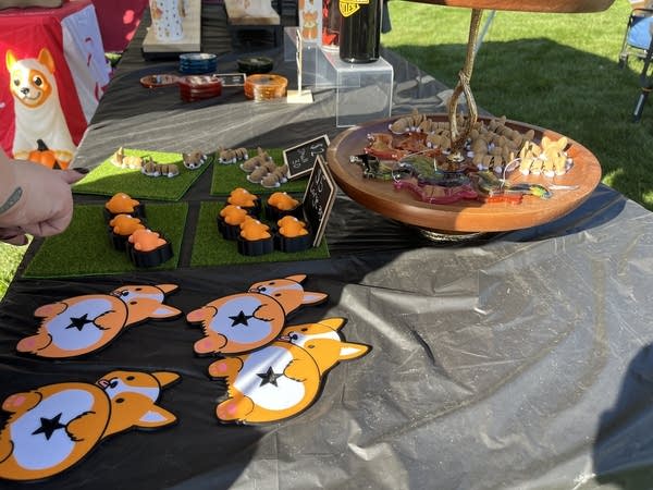 A collection of corgi-themed merch sits on a table.