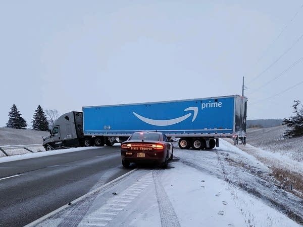 A jackknifed semi along an icy freeway