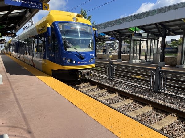 A train pulls into a station.