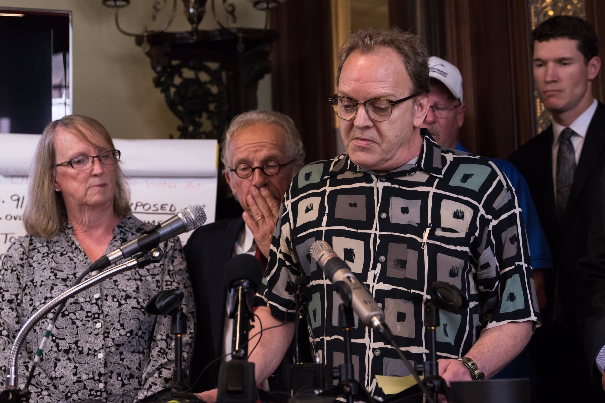 Jamie Heutmaker, a victim of abuse, speaks at a press conference.