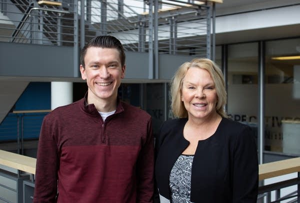 Two people pose for a photgraph.