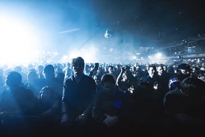 fans watch jamie xx djing on stage