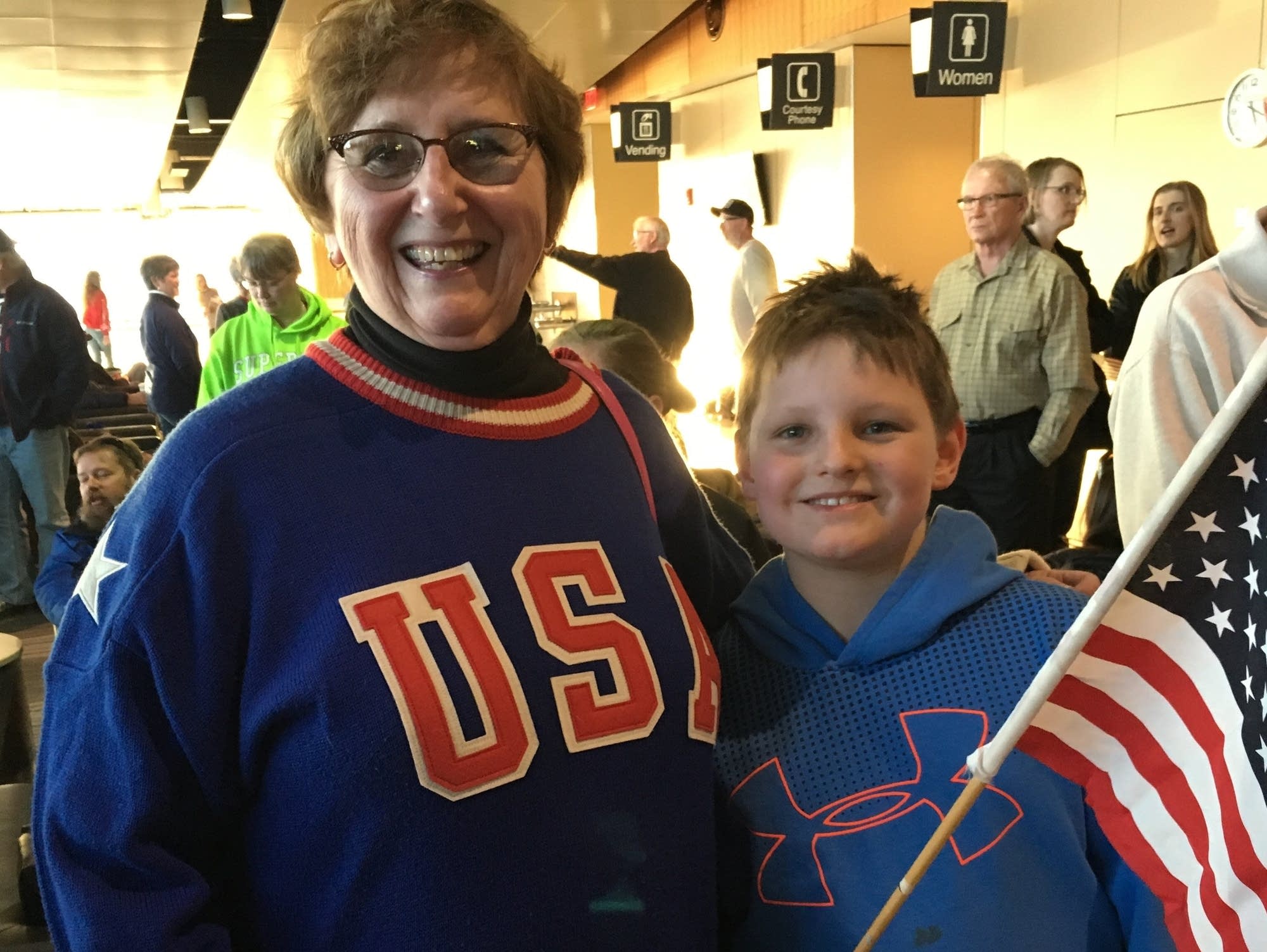Carol Holm and her grandson Tyler Stage awaited the U.S. Curling Team