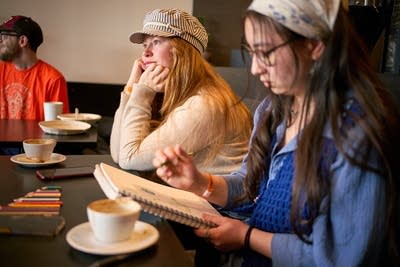 Music fans drink coffee and listen to music