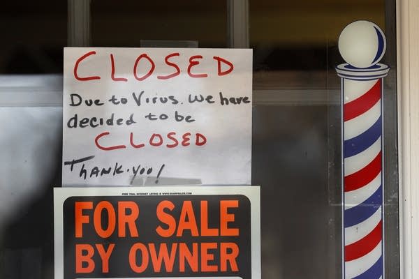 "For Sale By Owner" and "Closed Due to Virus" signs. 