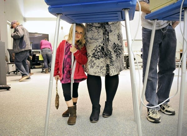 Payton Brown waits for her mom to vote