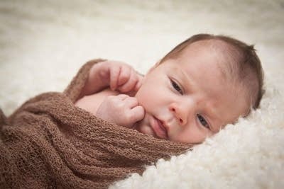 A photograph of an infant.