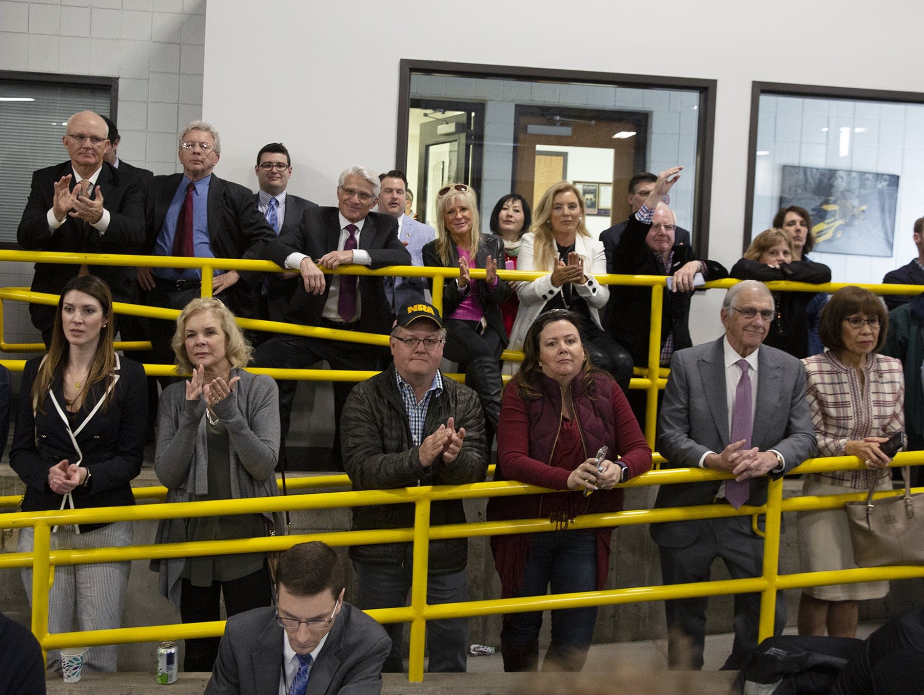 A crowd stands on a ramp to get a view of President Trump on April 15.